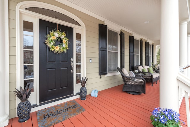 entrance to property featuring covered porch