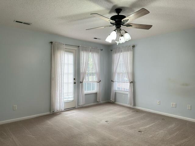 209 Myrtlewood Dr, Santee, SC 29142 - carpeted spare room featuring a ceiling fan, baseboards, and a textured ceiling