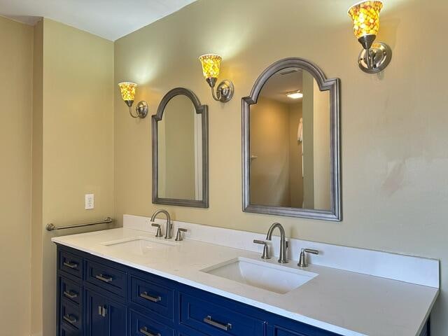 full bath with double vanity and a sink