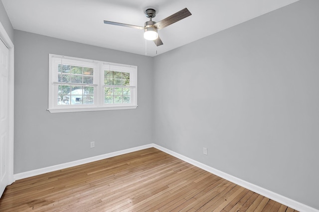 spare room featuring light hardwood / wood-style floors and ceiling fan