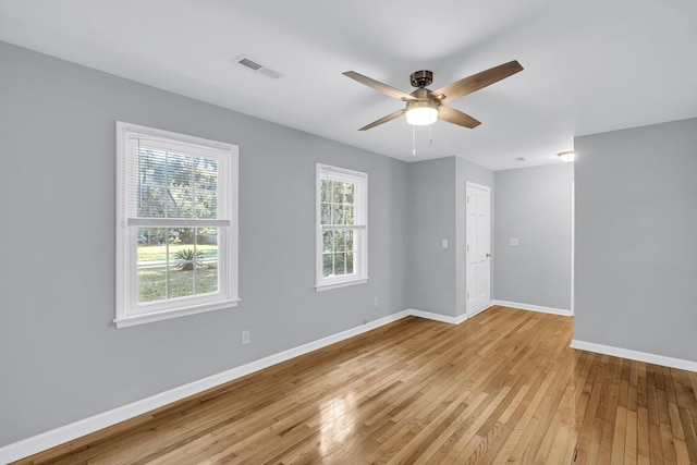 spare room with ceiling fan and light hardwood / wood-style floors