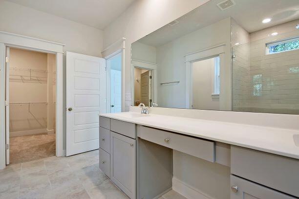 1423 Clay Field Trl, Summerville, SC 29485 - bathroom with a tile shower, vanity, and a spacious closet