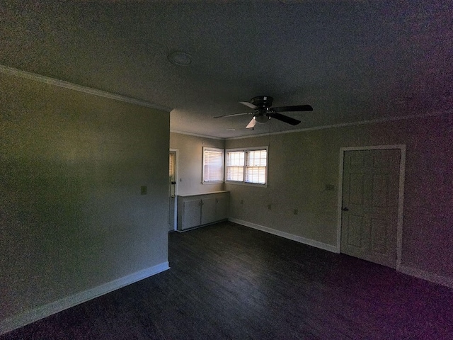 carpeted empty room with ornamental molding and ceiling fan