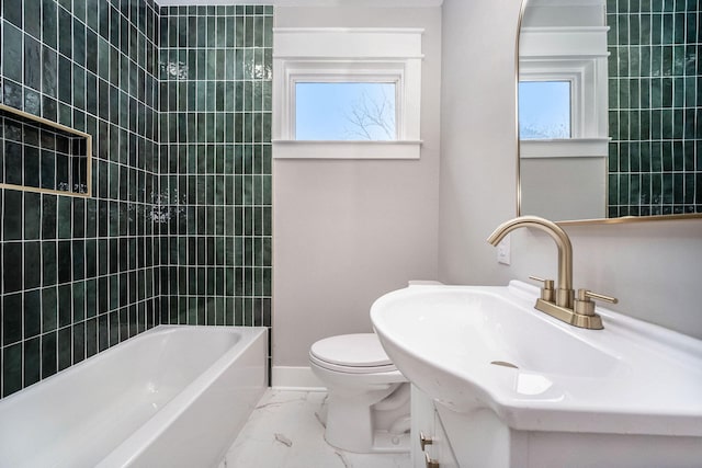 full bathroom featuring a healthy amount of sunlight, baseboards, toilet, and marble finish floor