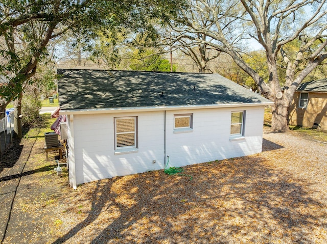 exterior space featuring fence and cooling unit