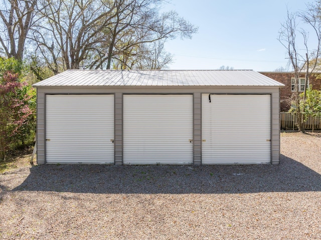 detached garage with fence