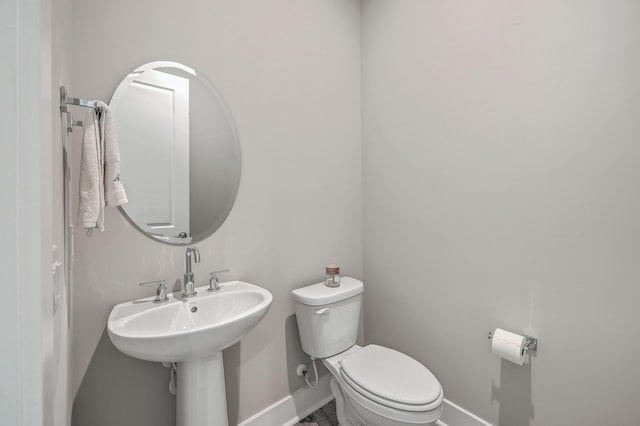 bathroom with toilet and sink