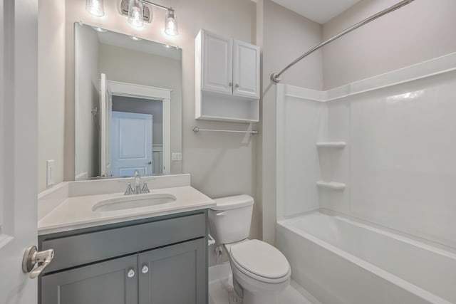 full bathroom featuring vanity, bathing tub / shower combination, and toilet