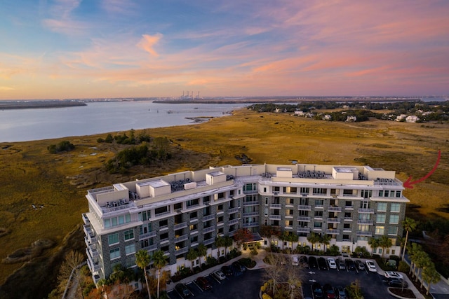 aerial view at dusk with a water view