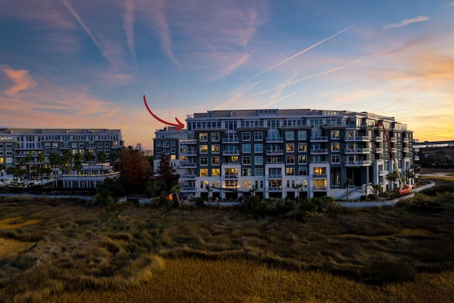 view of outdoor building at dusk