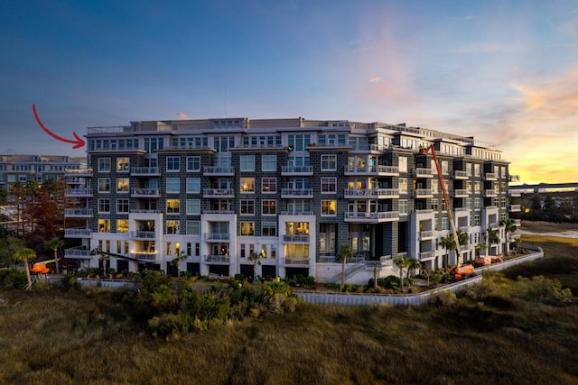 view of outdoor building at dusk