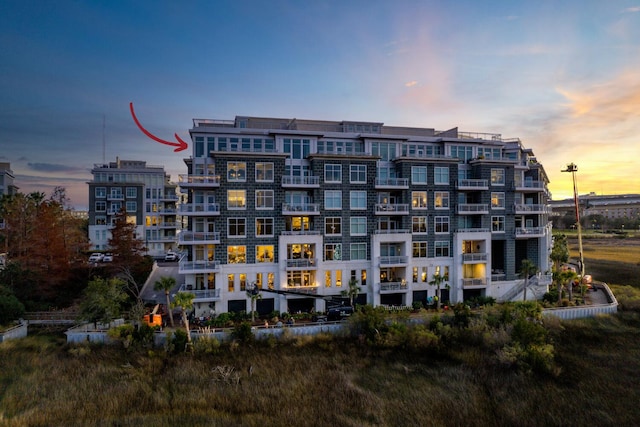 view of outdoor building at dusk