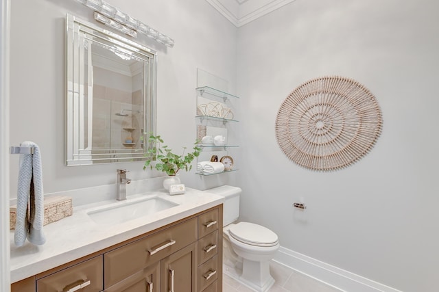 bathroom featuring tile patterned floors, vanity, toilet, and crown molding