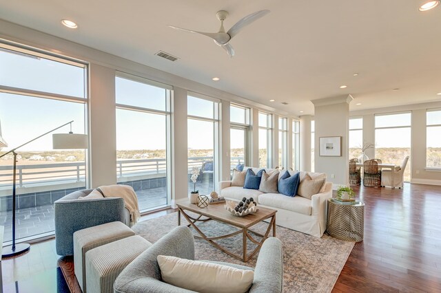 sunroom / solarium with plenty of natural light and ceiling fan