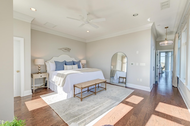 bedroom with dark hardwood / wood-style floors, ceiling fan, and ornamental molding