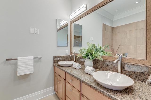 bathroom with vanity and ornamental molding