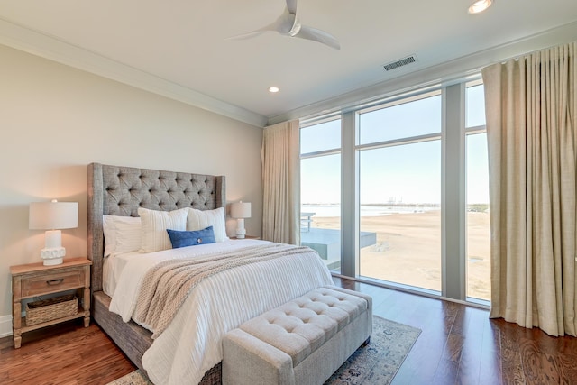 bedroom with access to outside, multiple windows, ceiling fan, and dark wood-type flooring