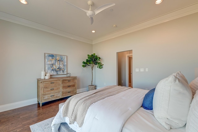 bedroom featuring dark hardwood / wood-style flooring, ceiling fan, and crown molding