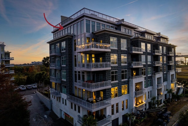 view of outdoor building at dusk