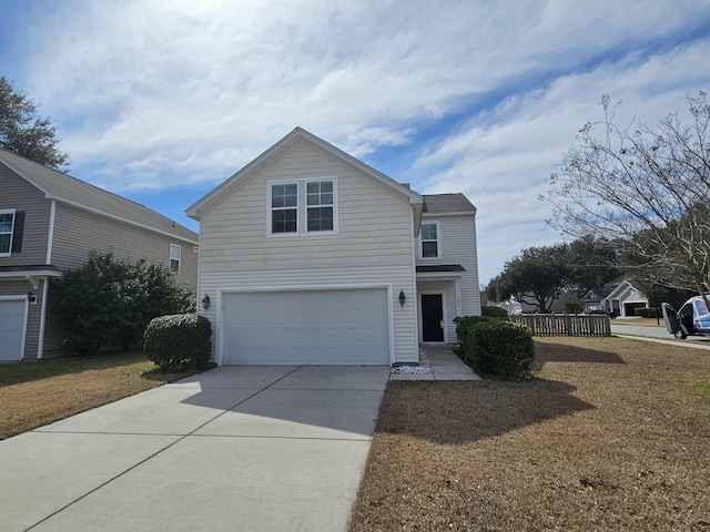 traditional home with a garage and driveway