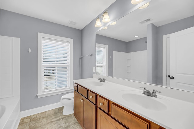 full bath with a tub to relax in, a sink, and visible vents