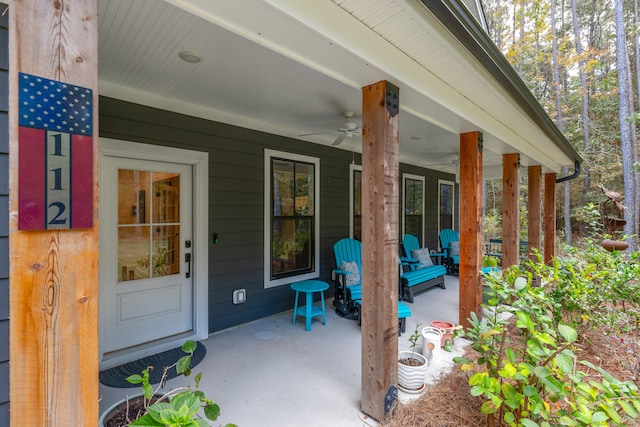 property entrance with a porch and ceiling fan