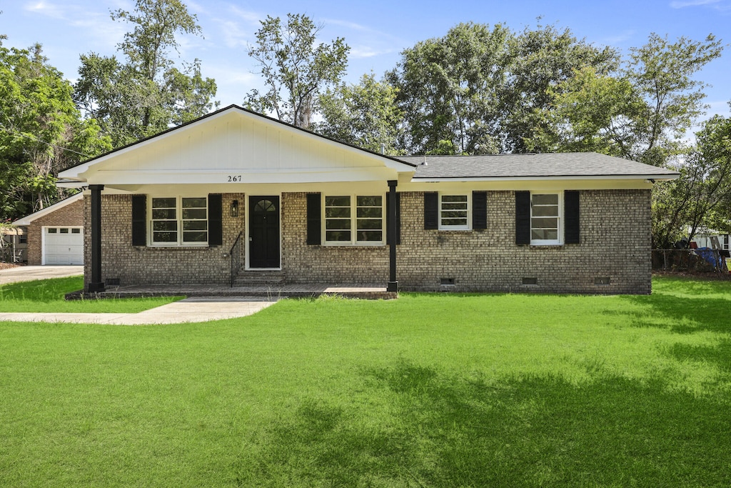 267 Industrial Rd, Walterboro, SC 29488 - ranch-style home with crawl space, brick siding, a front lawn, and a garage