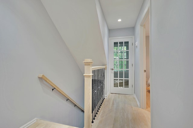 interior space with recessed lighting, baseboards, and wood finished floors