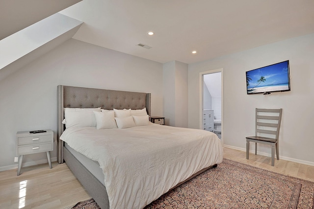 bedroom featuring recessed lighting, visible vents, baseboards, light wood-type flooring, and ensuite bath