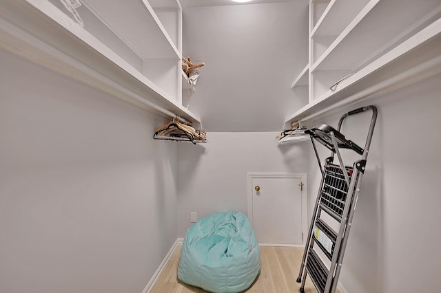 walk in closet featuring light wood-style floors