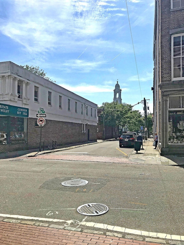 view of road featuring sidewalks and curbs