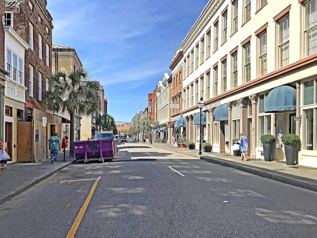 view of road with curbs and sidewalks