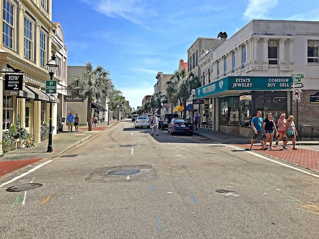 view of street with curbs, street lighting, and sidewalks