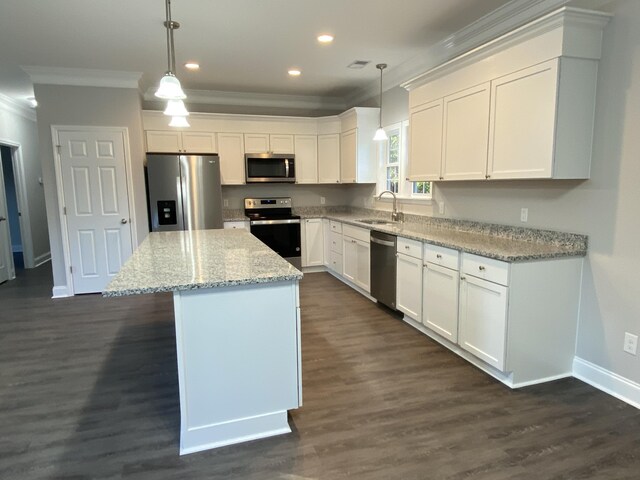 217 Middleton St, Eutawville, SC 29048 - kitchen with white cabinetry, appliances with stainless steel finishes, a sink, and ornamental molding
