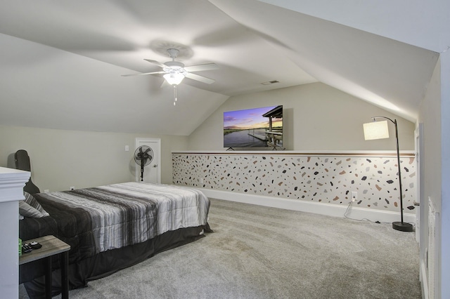 bedroom with lofted ceiling, a ceiling fan, visible vents, and carpet