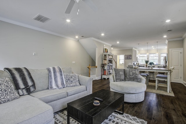 living area with recessed lighting, dark wood finished floors, visible vents, a ceiling fan, and ornamental molding