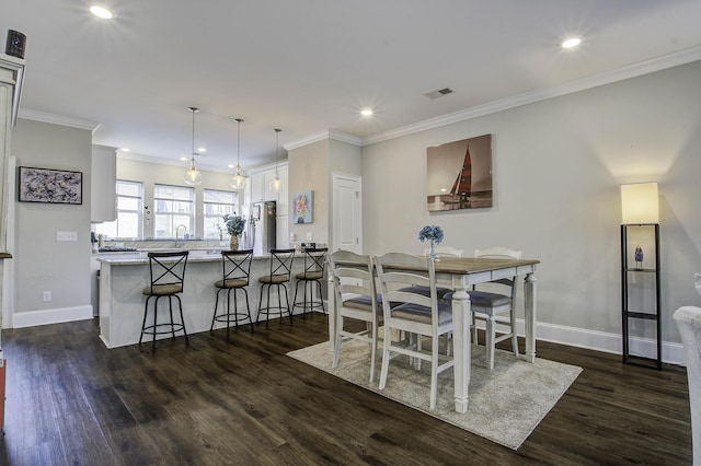 dining room featuring dark wood finished floors, visible vents, and recessed lighting