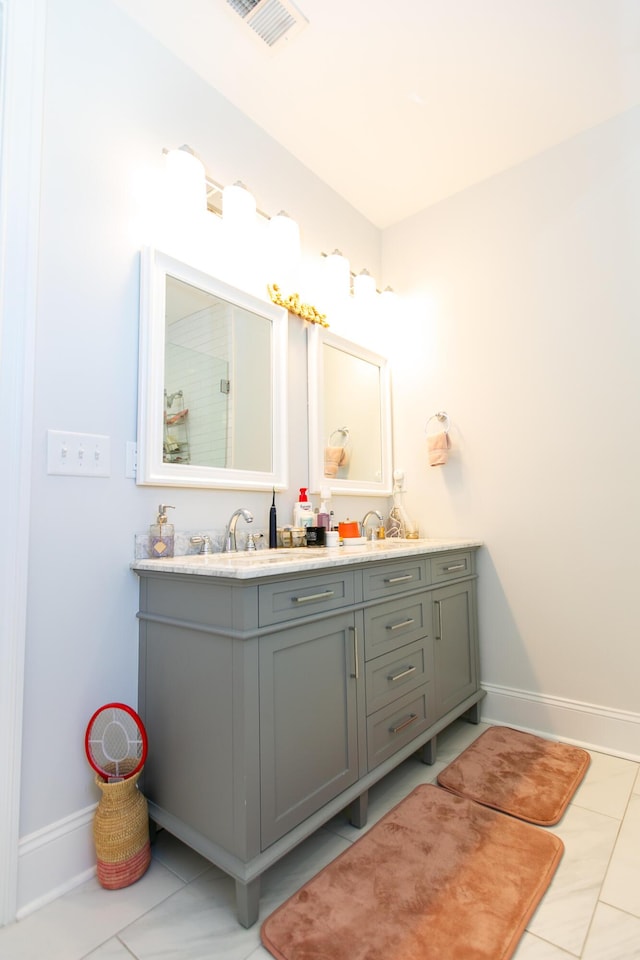 bathroom with vanity and tile patterned floors