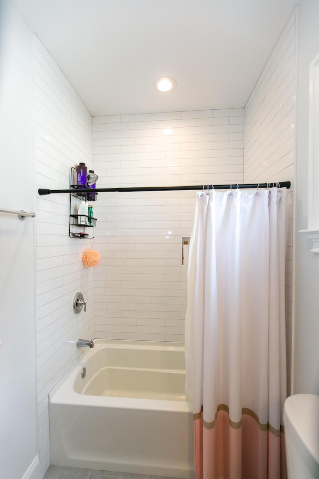 bathroom with shower / bathtub combination with curtain