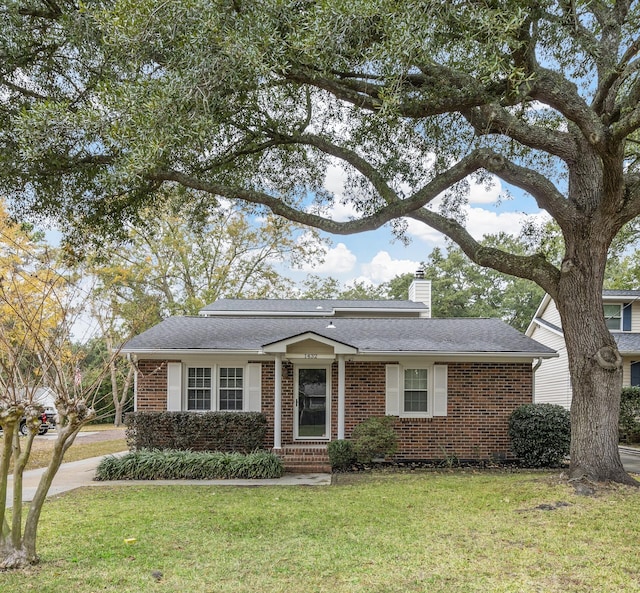 ranch-style home with a front lawn