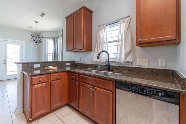 kitchen with sink, decorative light fixtures, light tile patterned floors, dishwasher, and kitchen peninsula