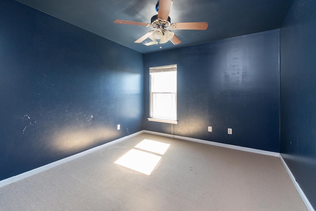 spare room with carpet and ceiling fan