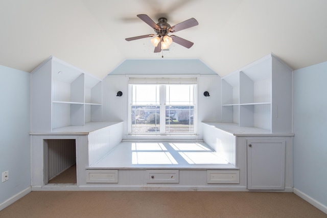 additional living space featuring lofted ceiling, light colored carpet, and ceiling fan