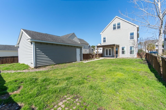 back of house with a pergola and a lawn