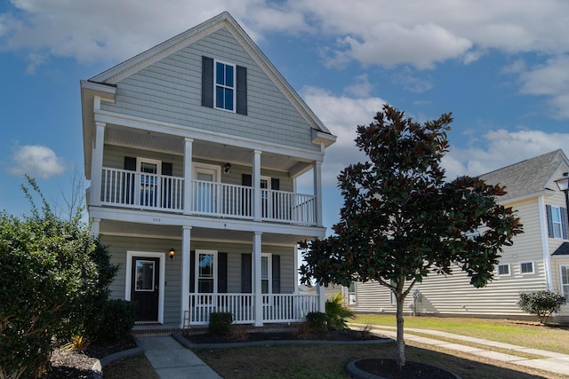 view of front of home with a balcony and a porch