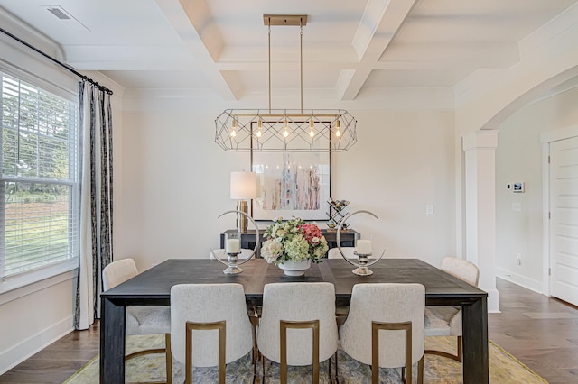 dining space with baseboards, arched walkways, coffered ceiling, and wood finished floors