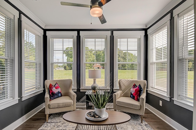 sunroom featuring ceiling fan