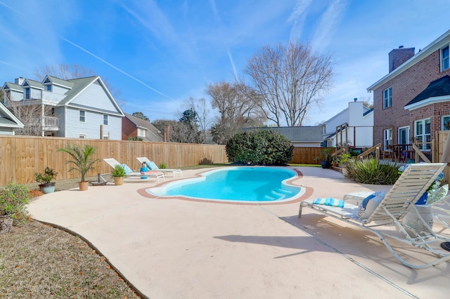 view of swimming pool with a fenced in pool, a patio area, and a fenced backyard