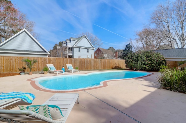 view of pool featuring a fenced backyard, a fenced in pool, and a patio