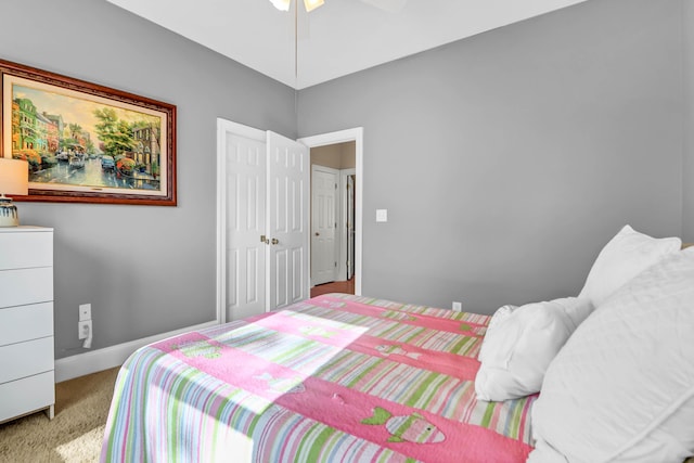 bedroom with carpet, baseboards, and ceiling fan